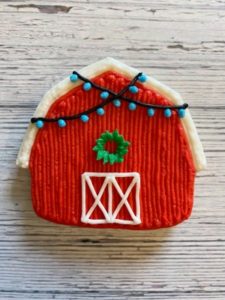 decorated Christmas barn buttercream cookies
