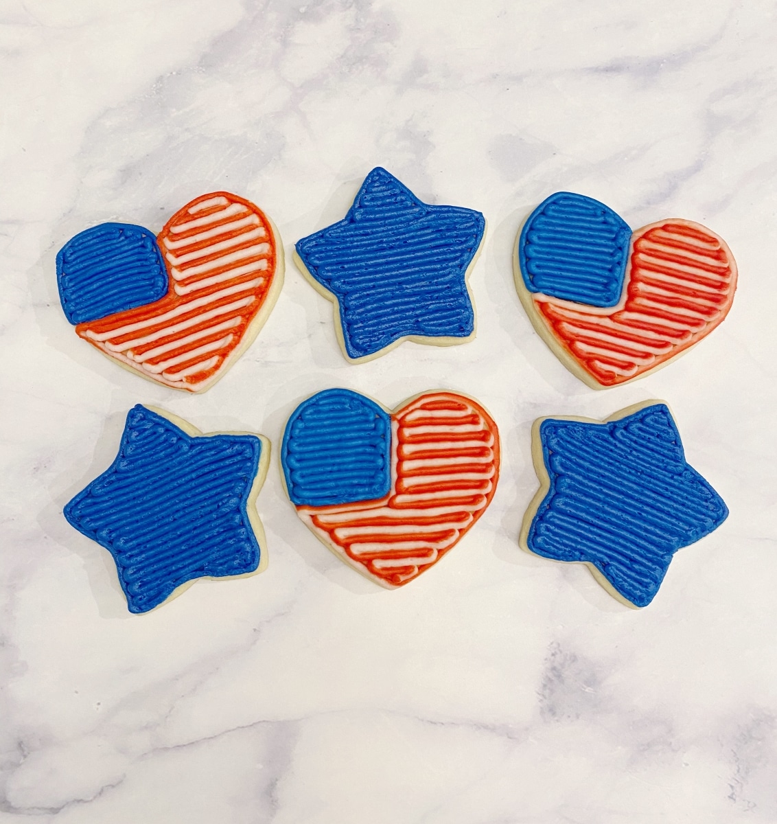 red white and blue cookies with buttercream