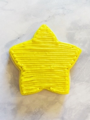 glow party cookies with buttercream icing yellow star