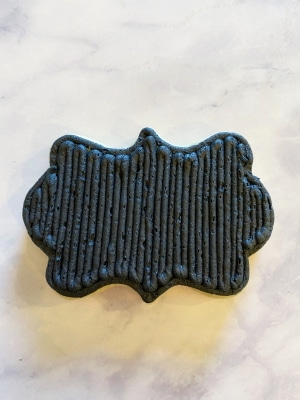 black buttercream plaque
