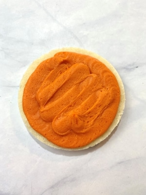 orange buttercream with a tip #12