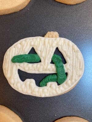 Halloween snake sugar cookies with buttercream stem and snake added
