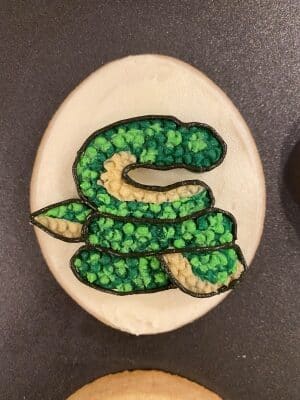 snake sugar cookies with buttercream outline the snake's body